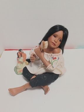 Artisan Black-Haired Porcelain Doll in Embroidered Cream Blouse and Black Pants